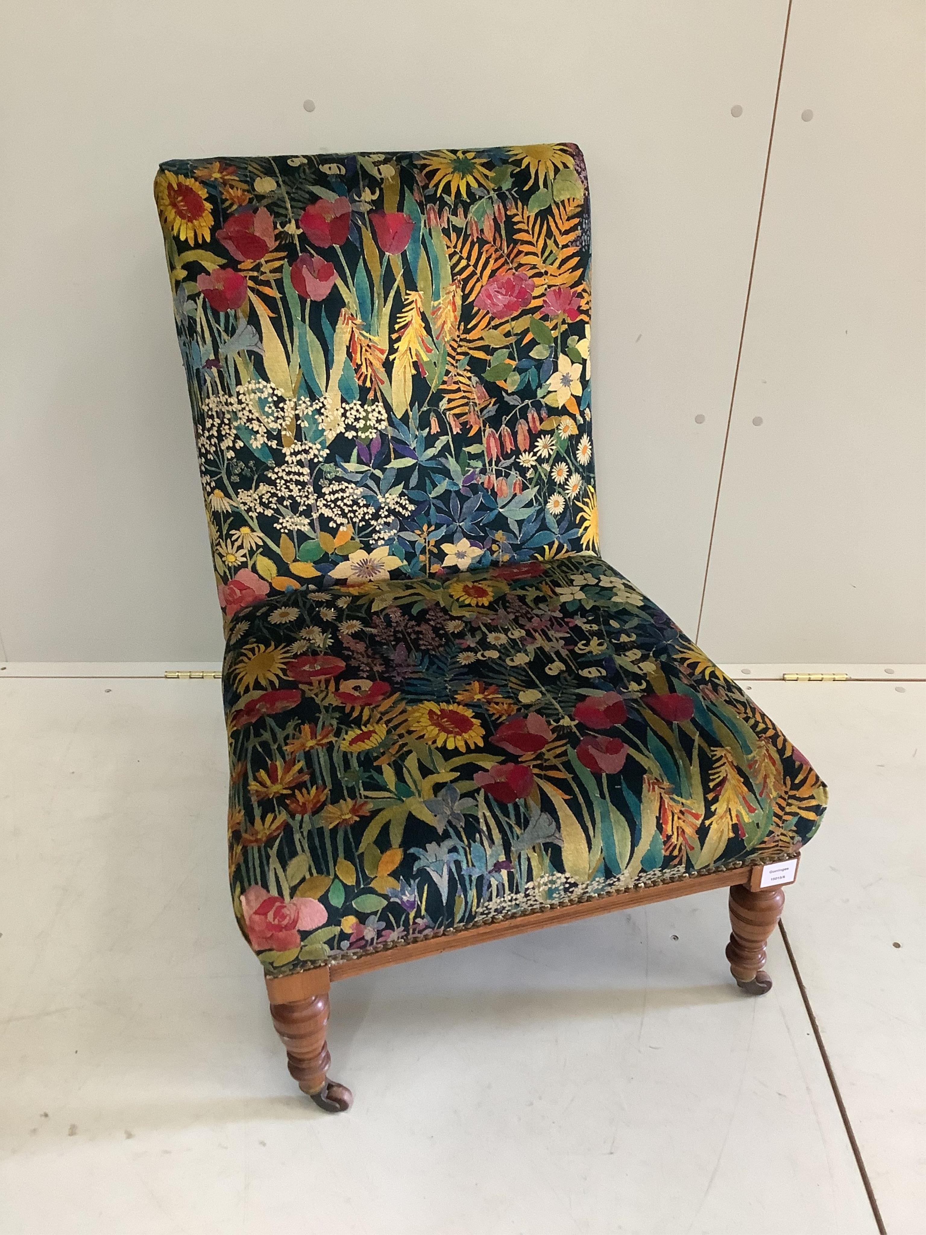A 19th century mahogany nursing chair, upholstered in Liberty fabric, width 62cm, depth 66cm, height 86cm. Condition - good